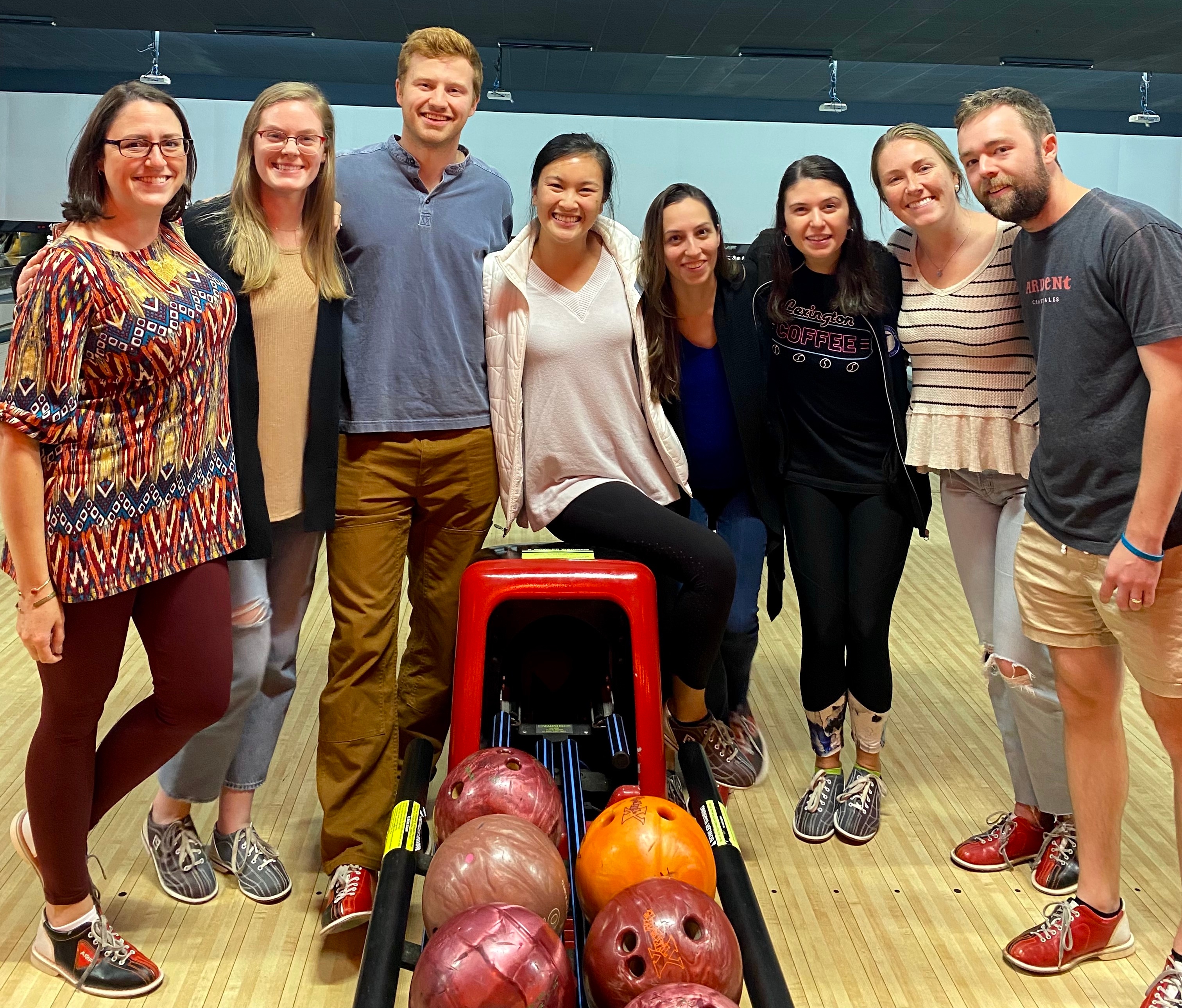 Residents pose for a group photo at the bowling alley