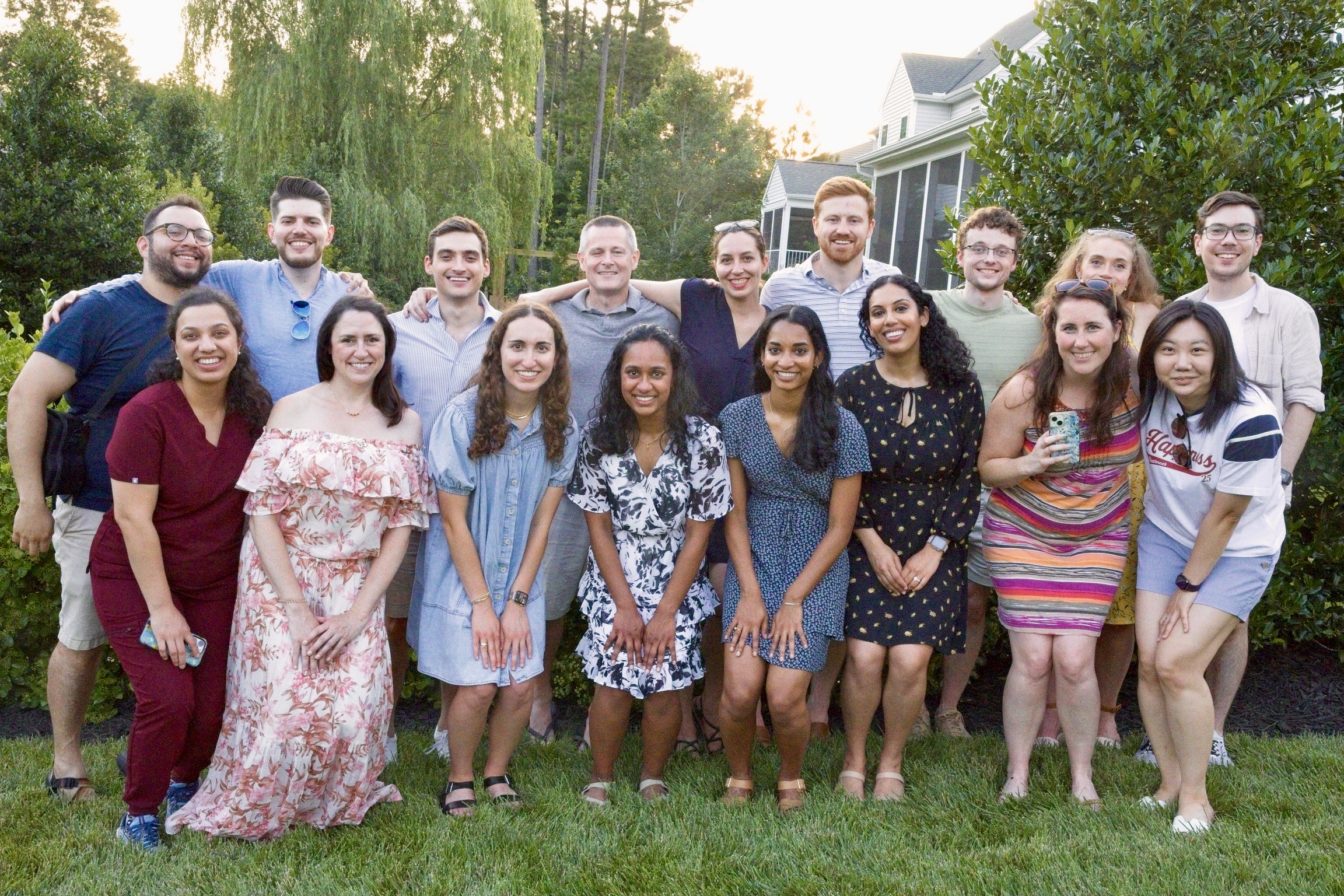 large group photo of residents, faculty, and alumni posing at 2025 Intern Welcome Reception