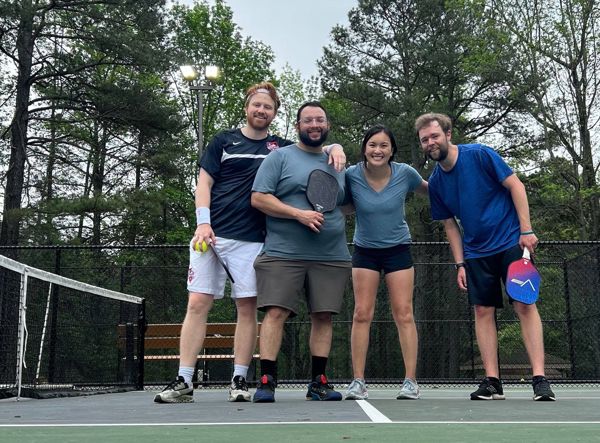 4 residents pose after playing pickleball with peds co-residents and faculty