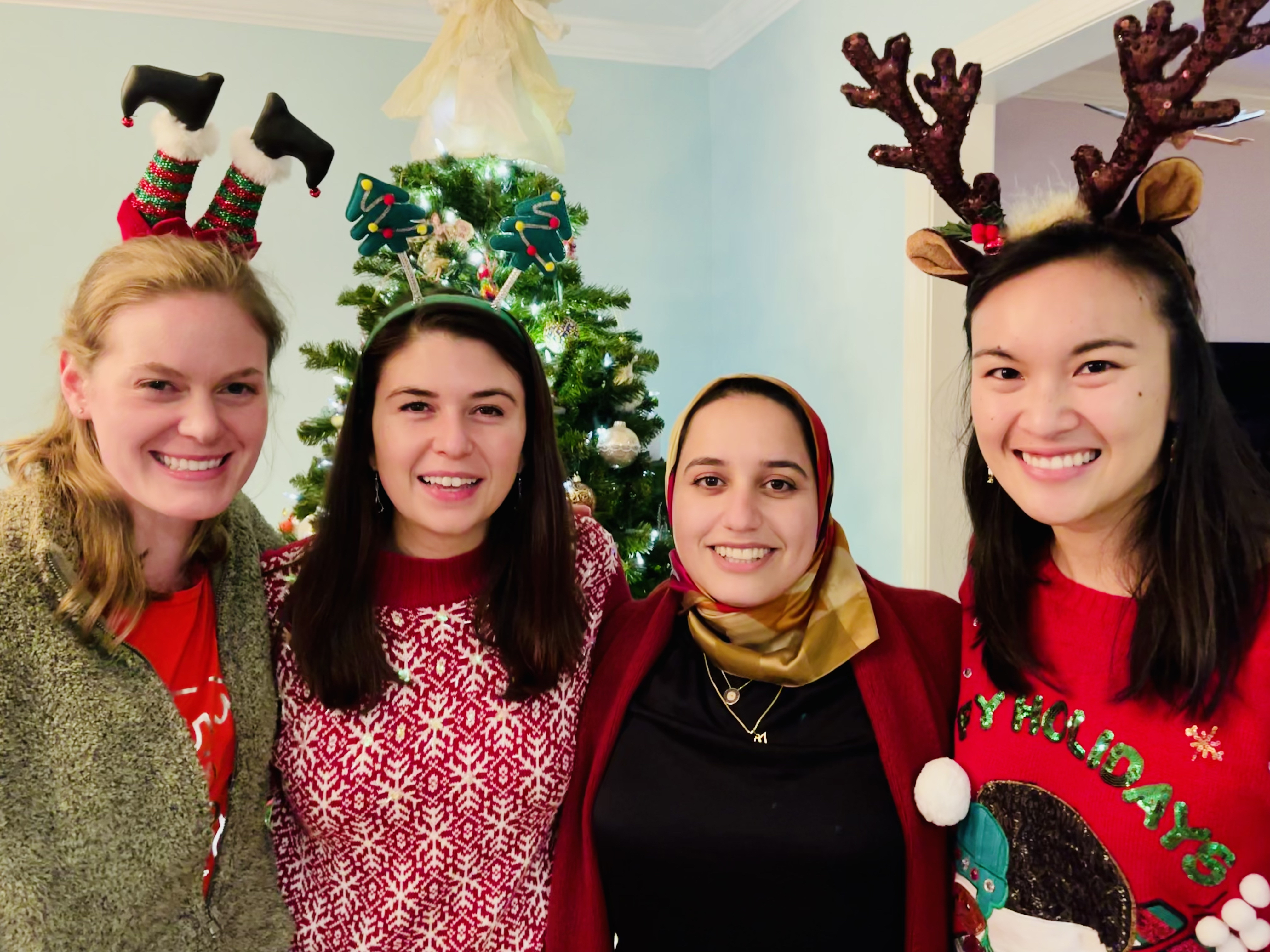 Female residents pose with holiday headbands