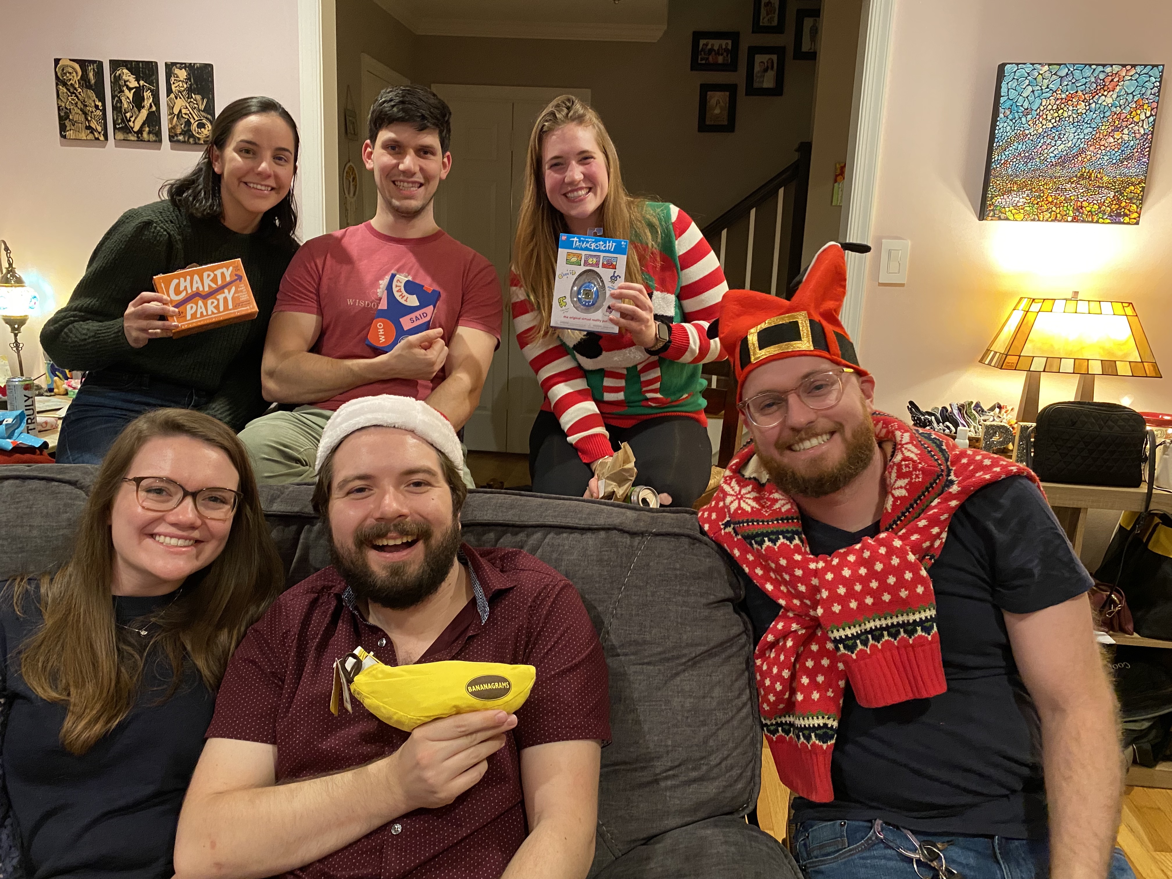 A group of residents show off their goodies from a holiday party gift exchange