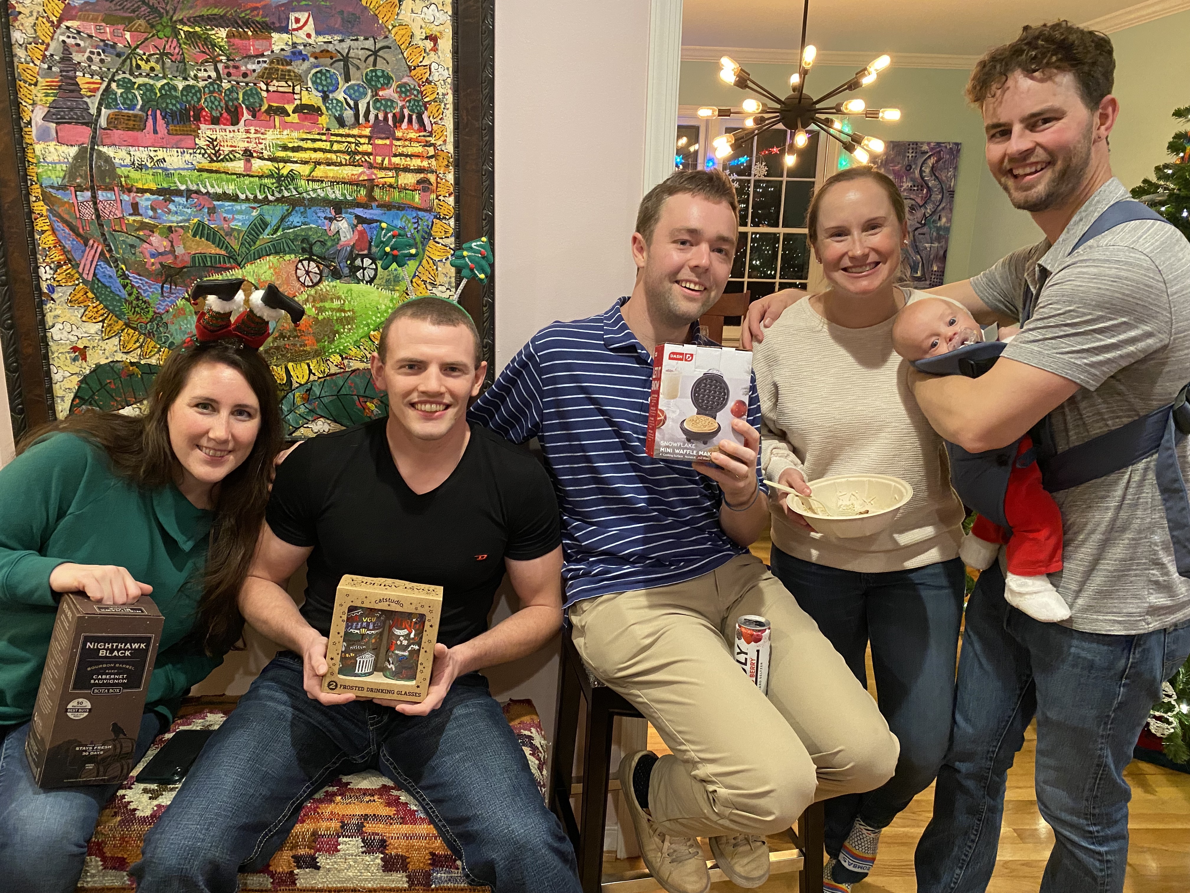 A group of residents show off their goodies from a holiday party gift exchange