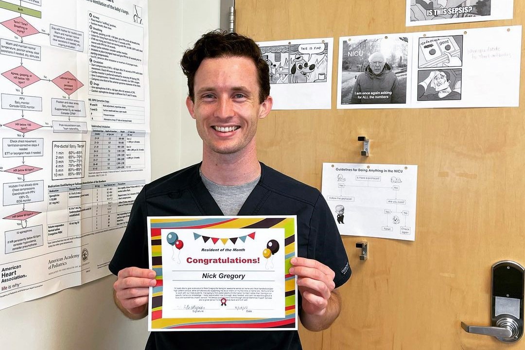 Resident Nick Gregory displays his Resident of the Month certificate